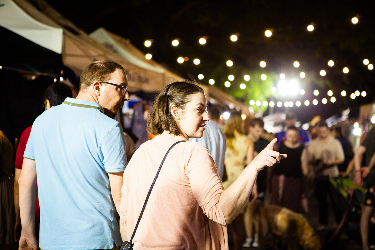 Marketgoers enjoying the evening